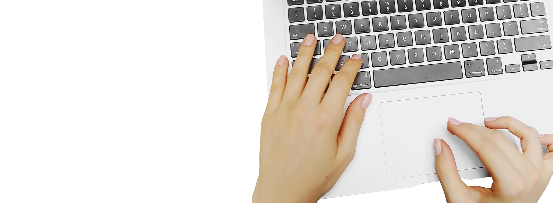 The image shows a person s hand typing on a laptop keyboard, with the laptop screen facing away from the viewer.