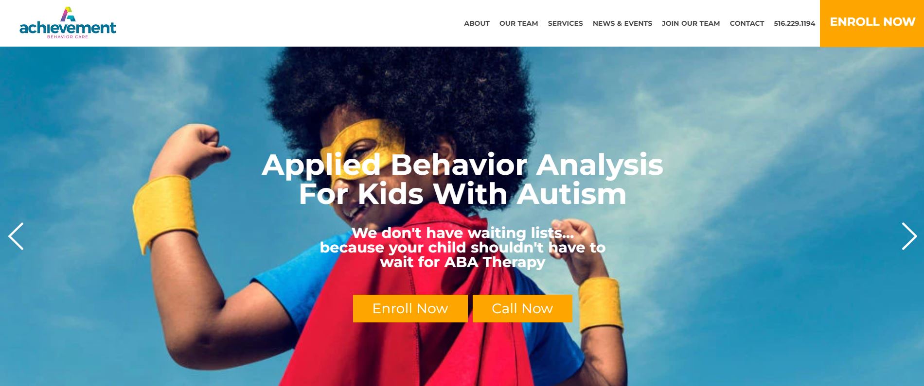 The image is a screenshot of a website with a colorful design, featuring a central figure that appears to be a child in a superhero costume with the word 'APPLIED' written on it. The background of the image shows a clear sky and clouds.