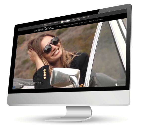The image displays a computer monitor with a woman's face on the screen, which is part of a website interface.
