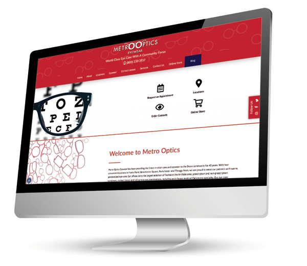 The image displays a computer monitor with the website of 'Metro Optics' open, showcasing a webpage design featuring a prominent logo, navigation menu, and placeholder content.