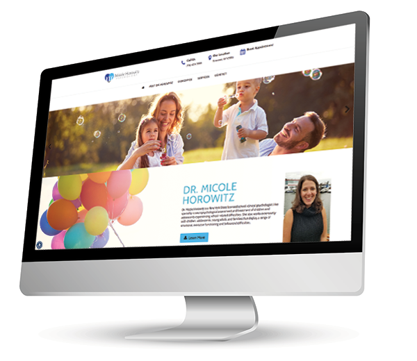 The image shows a computer monitor displaying a website with a family photo and a colorful balloon background, featuring a woman in the foreground.