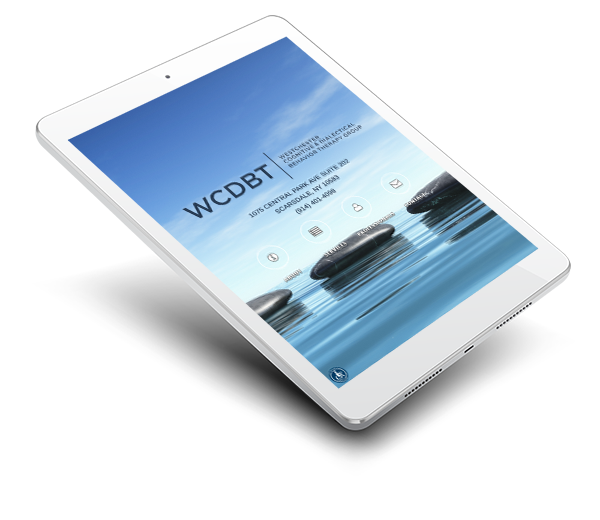 The image shows a tablet displaying a digital advertisement featuring a serene beach scene with the text 'WCDT' prominently displayed, accompanied by a logo and additional text that is too small to read clearly.