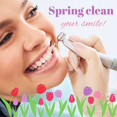 A close-up image of a person's smiling face with a dental hygiene device, featuring text that reads 'SPRING CLEAN YOUR SMILE!' and a graphic of tulips.